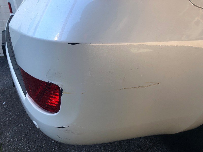 Vehicle bumper scratch before repair